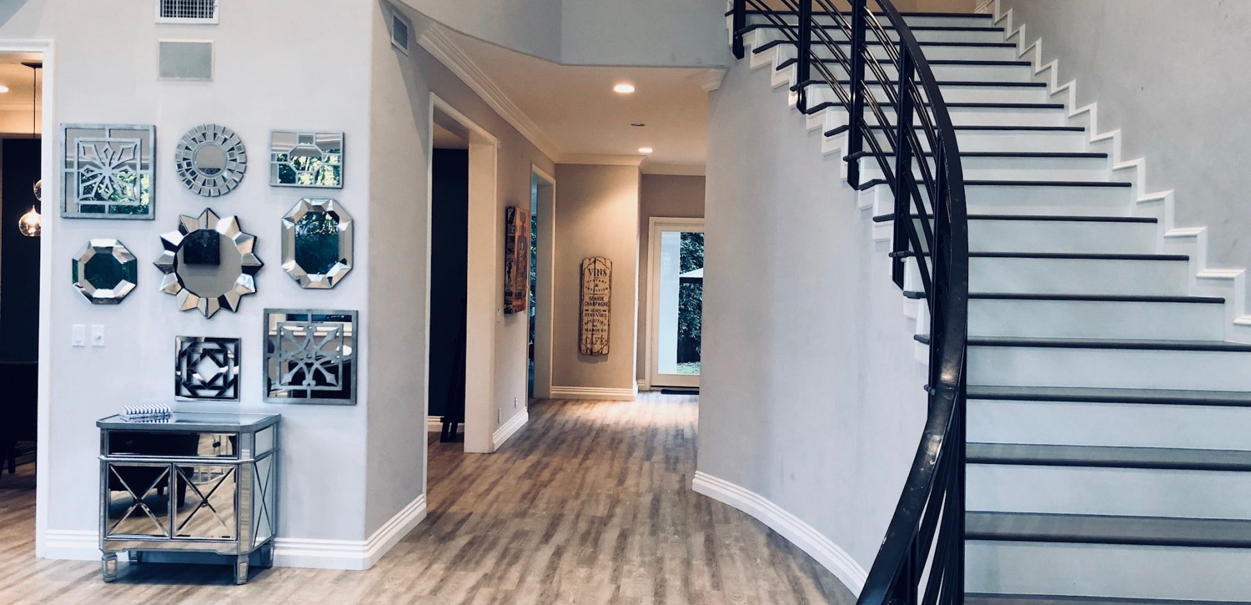 Stairs-Living-Room-with-Hallway-to-Den-Kitchen